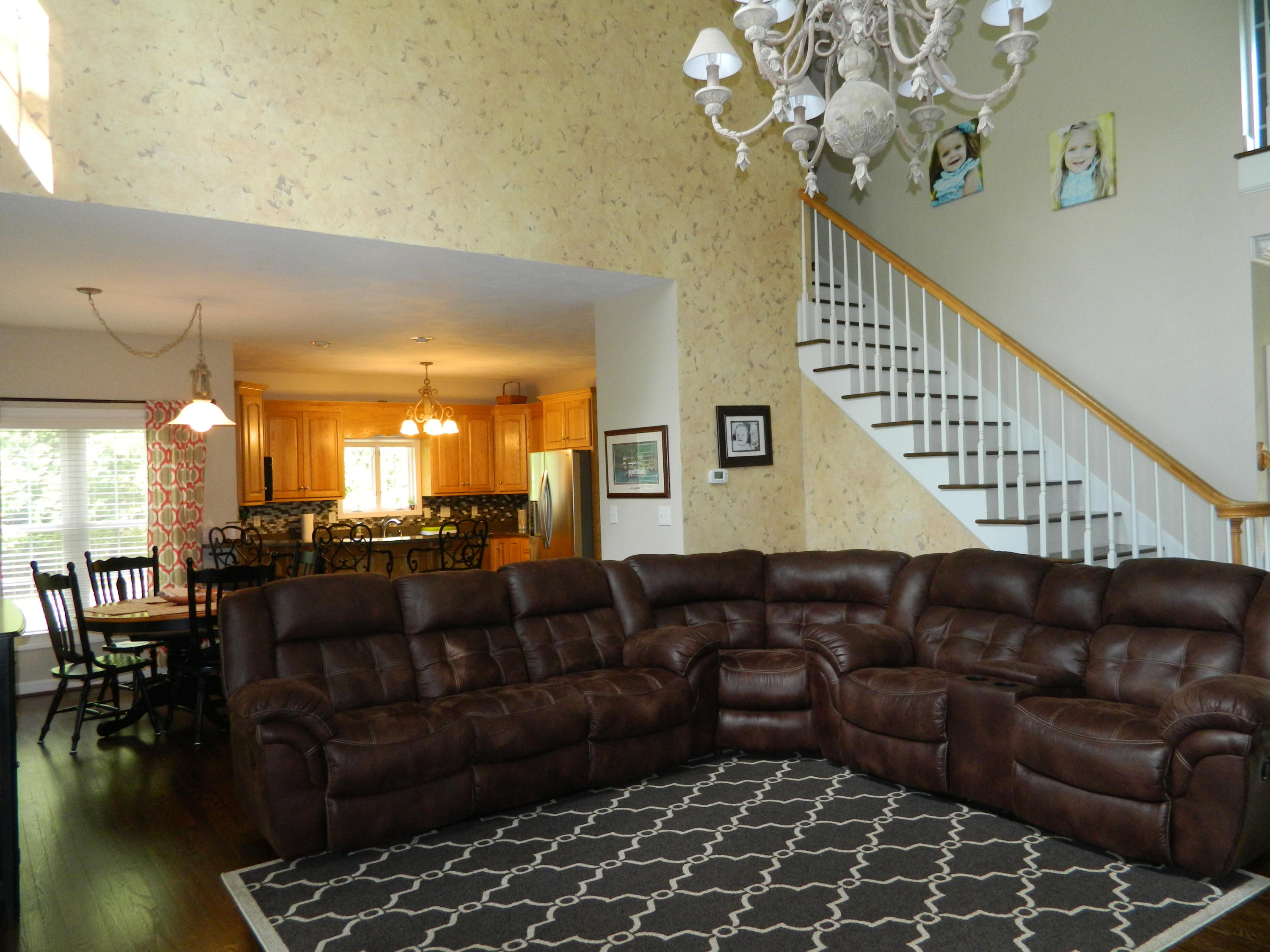 75 Cobblestone Drive Blue Ridge, VA 24064 - Photo 4 of 60 a living room with furniture a dining table and a chandelier