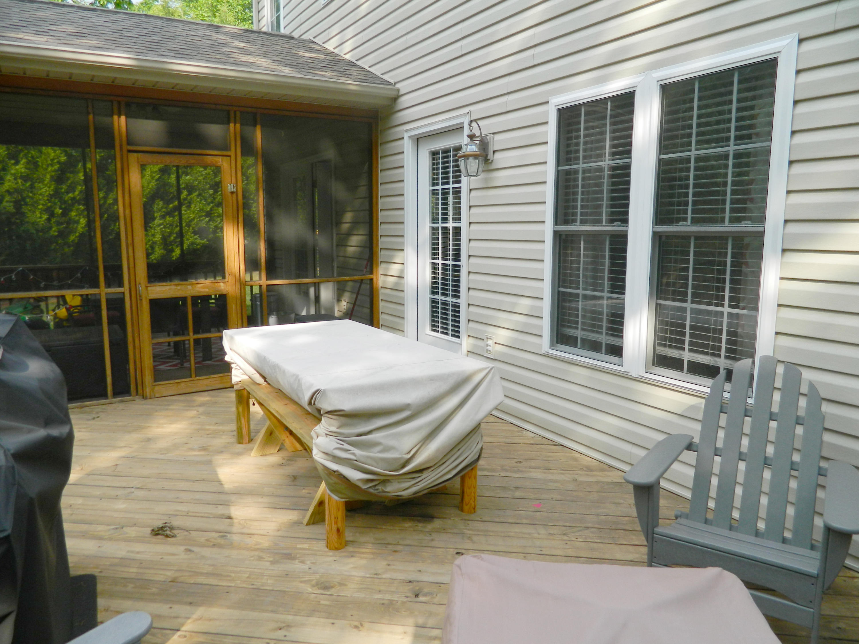 75 Cobblestone Drive Blue Ridge, VA 24064 - Photo 45 of 60 a view of a patio with table and chairs and wooden floor