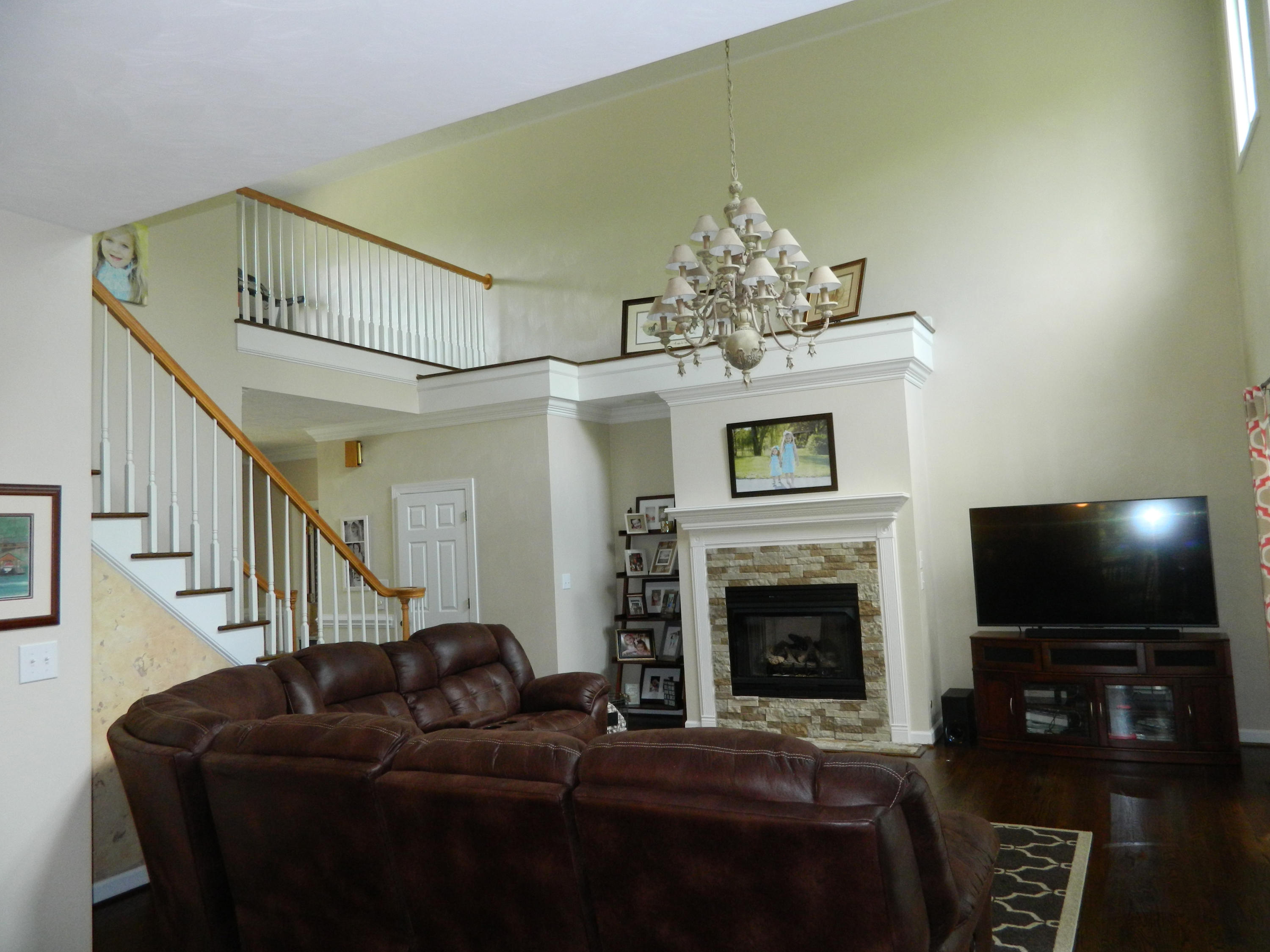 75 Cobblestone Drive Blue Ridge, VA 24064 - Photo 6 of 60 a living room with furniture a flat screen tv and a fireplace