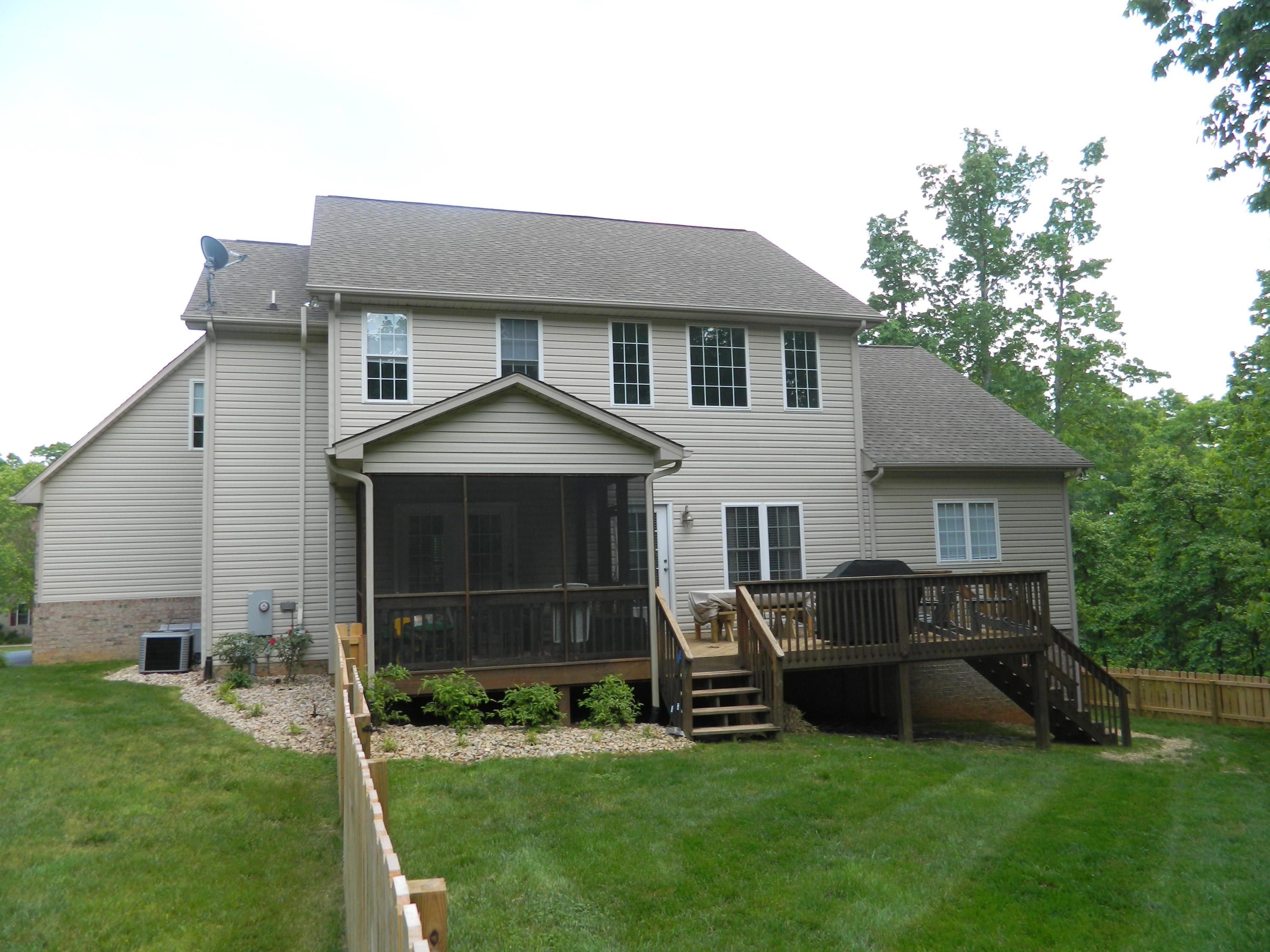 75 Cobblestone Drive Blue Ridge, VA 24064 - Photo 51 of 60 a front view of a house with a garden and yard
