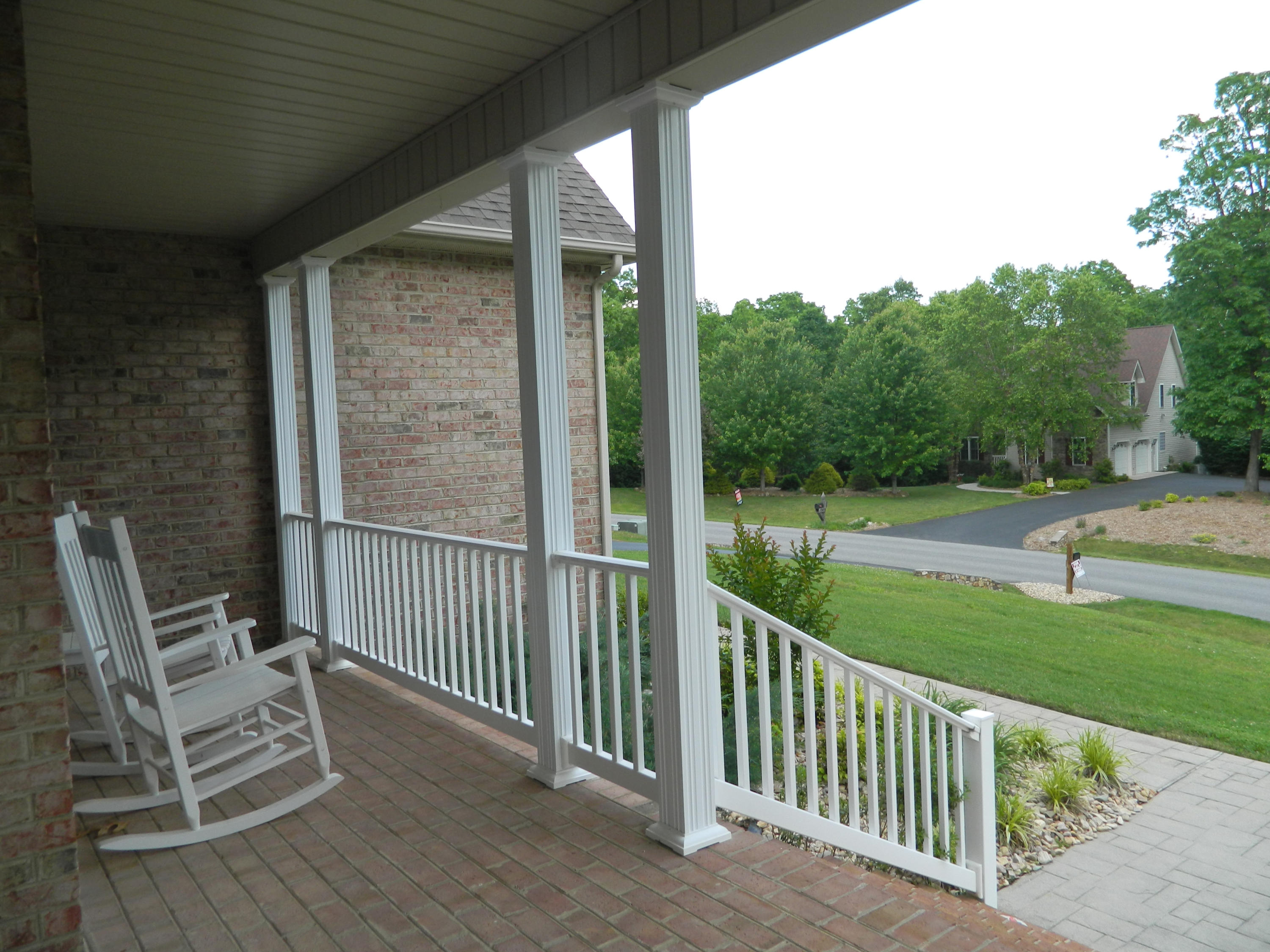 75 Cobblestone Drive Blue Ridge, VA 24064 - Photo 56 of 60 a view of a chair and tables in the balcony