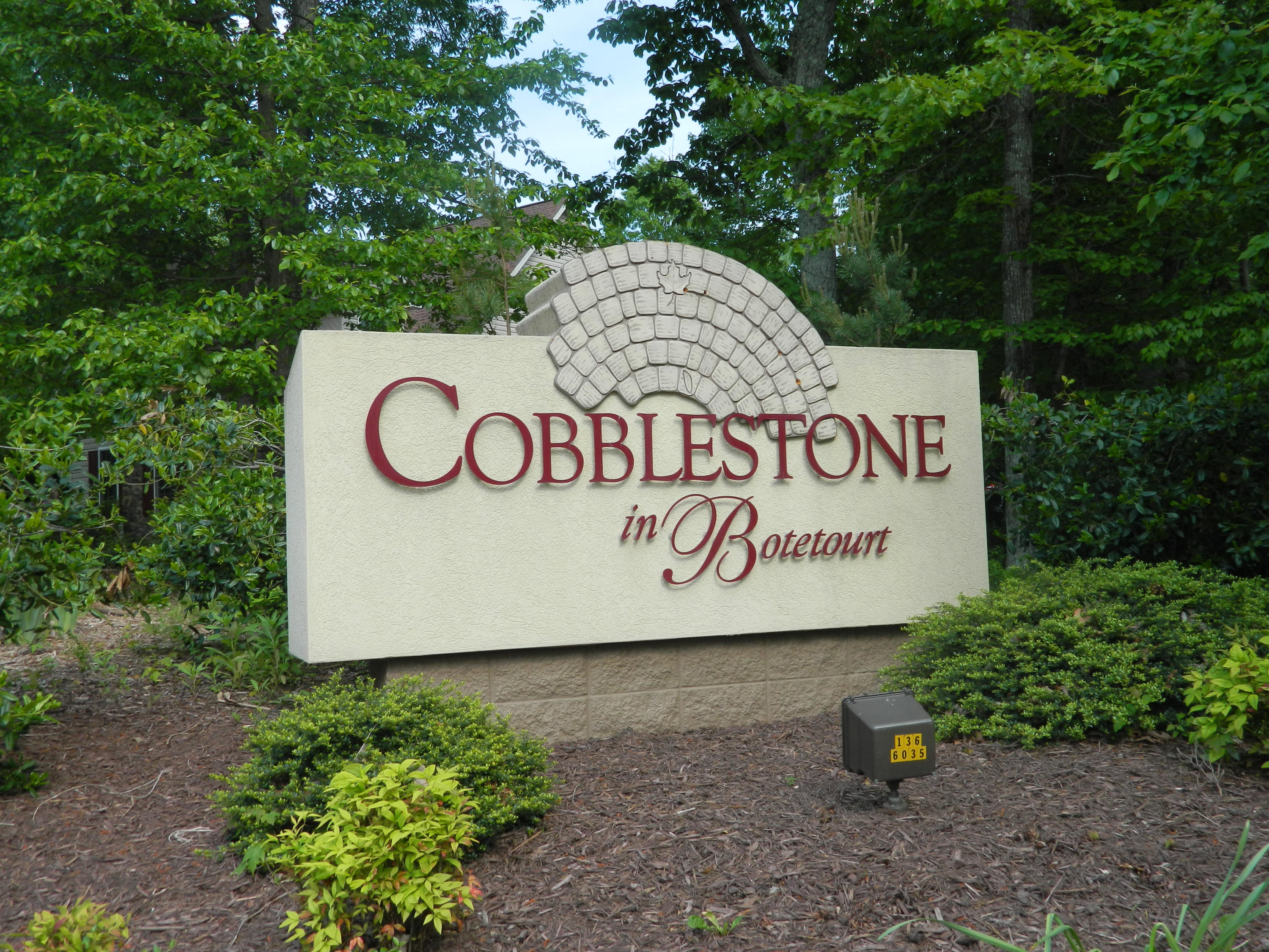 75 Cobblestone Drive Blue Ridge, VA 24064 - Photo 60 of 60 a sign that is sitting on a wooden bench