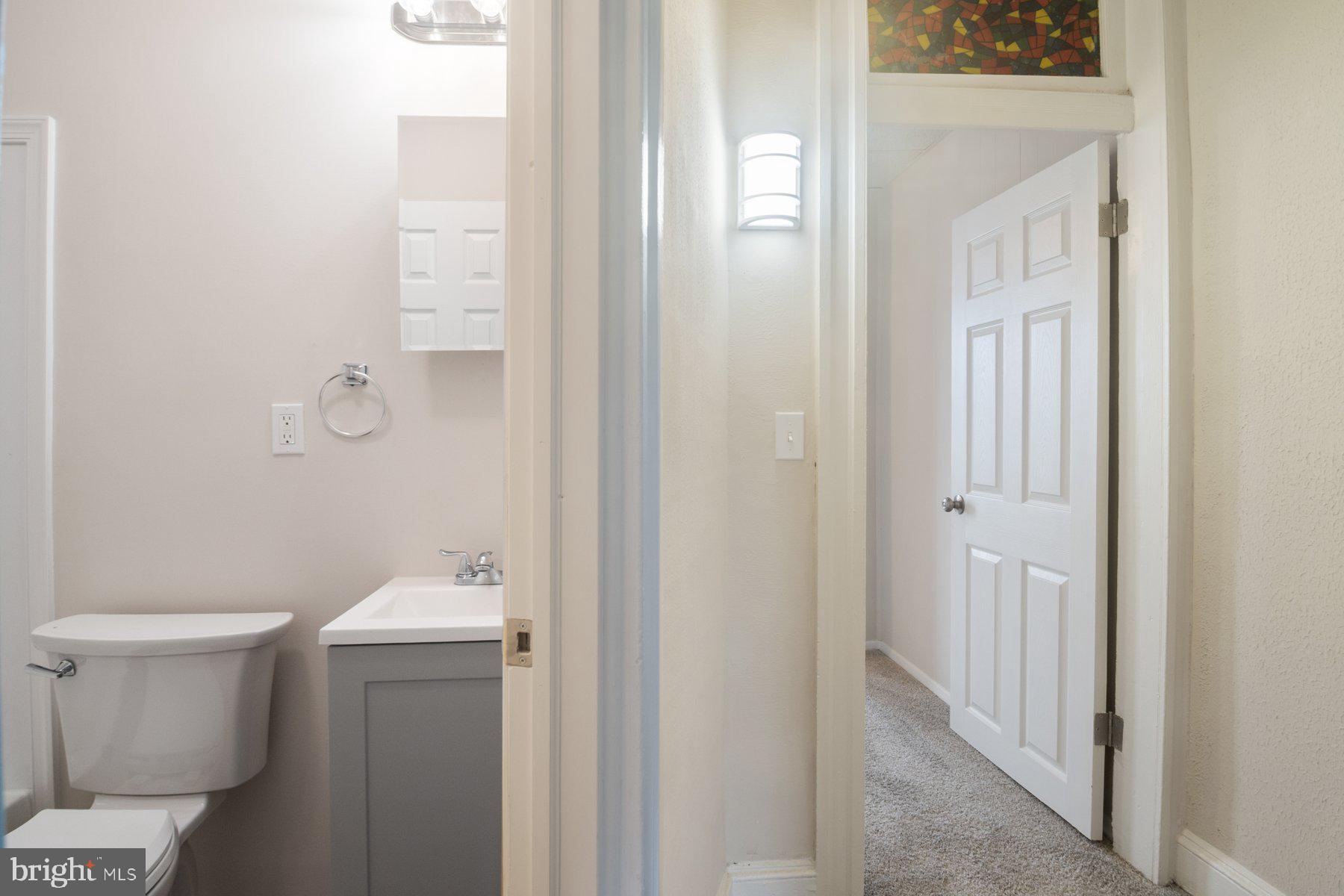 602 North Decker Avenue Baltimore, MD 21205 - Photo 11 of 16 a bathroom with a toilet and a sink