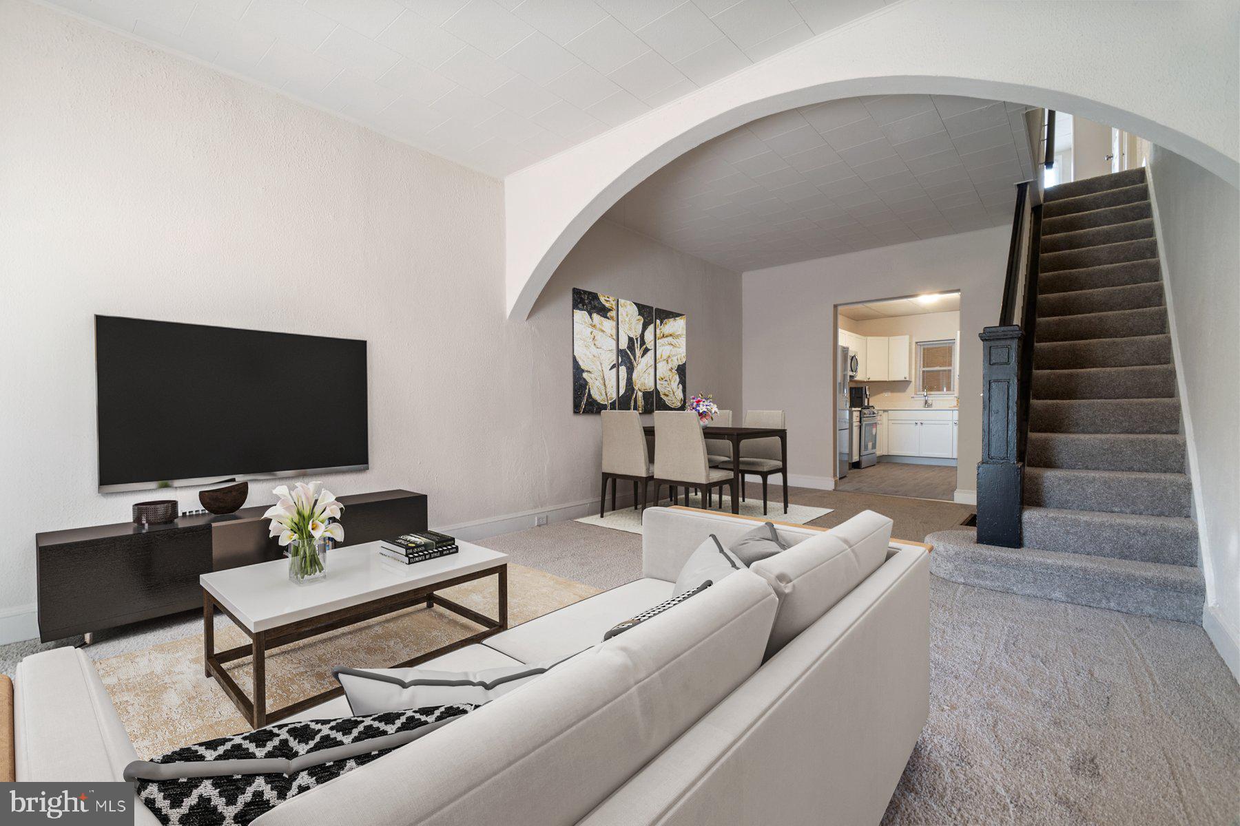 602 North Decker Avenue Baltimore, MD 21205 - Photo 2 of 16 a living room with furniture and a flat screen tv