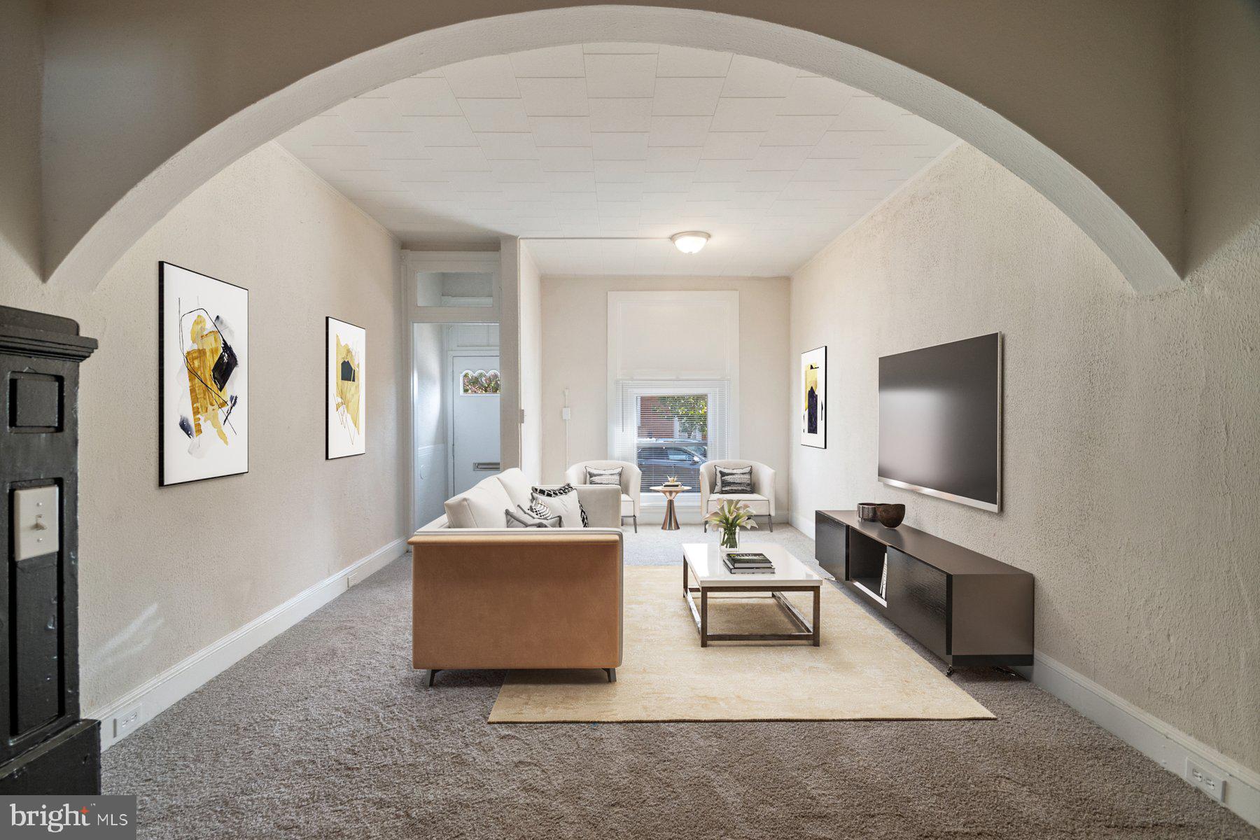 602 North Decker Avenue Baltimore, MD 21205 - Photo 3 of 16 a living room with furniture and a flat screen tv