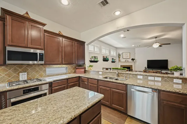 a dining room with furniture and window