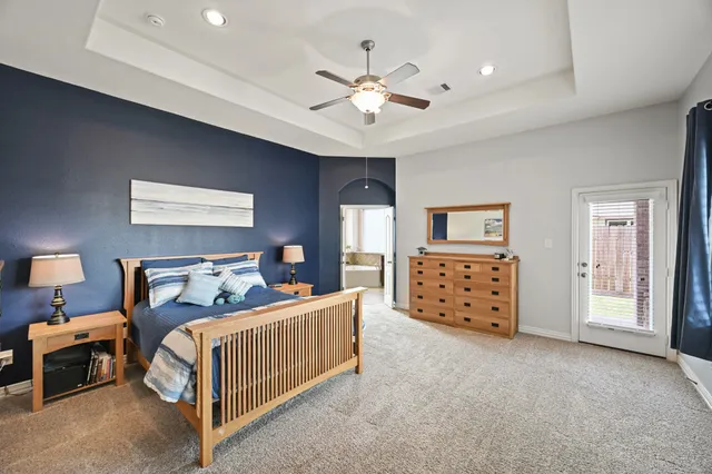 a bedroom with a bed furniture and a window