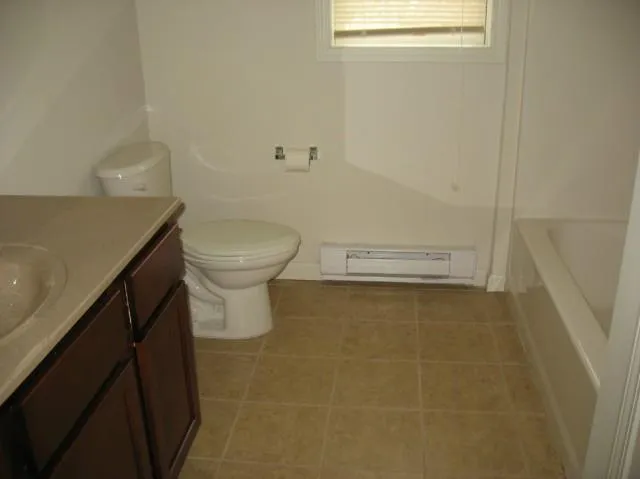 a bathroom with a toilet and a sink