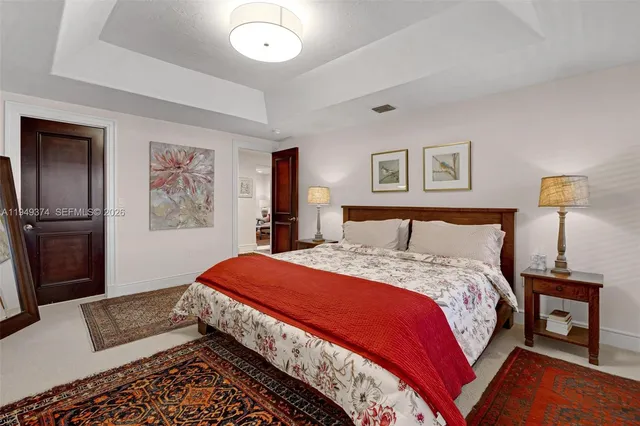 a bedroom with a bed and a lamp on table