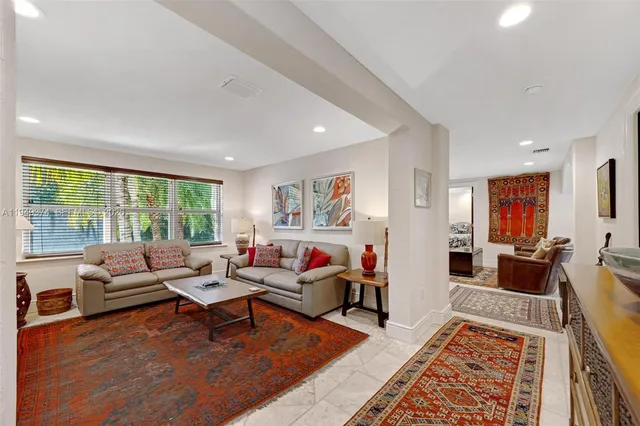 a living room with furniture and a rug