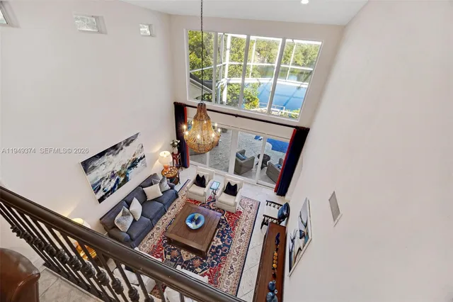 a living room with furniture windows and wooden floor