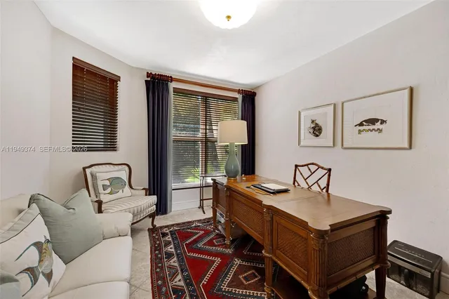 a bed room with a bed and a window