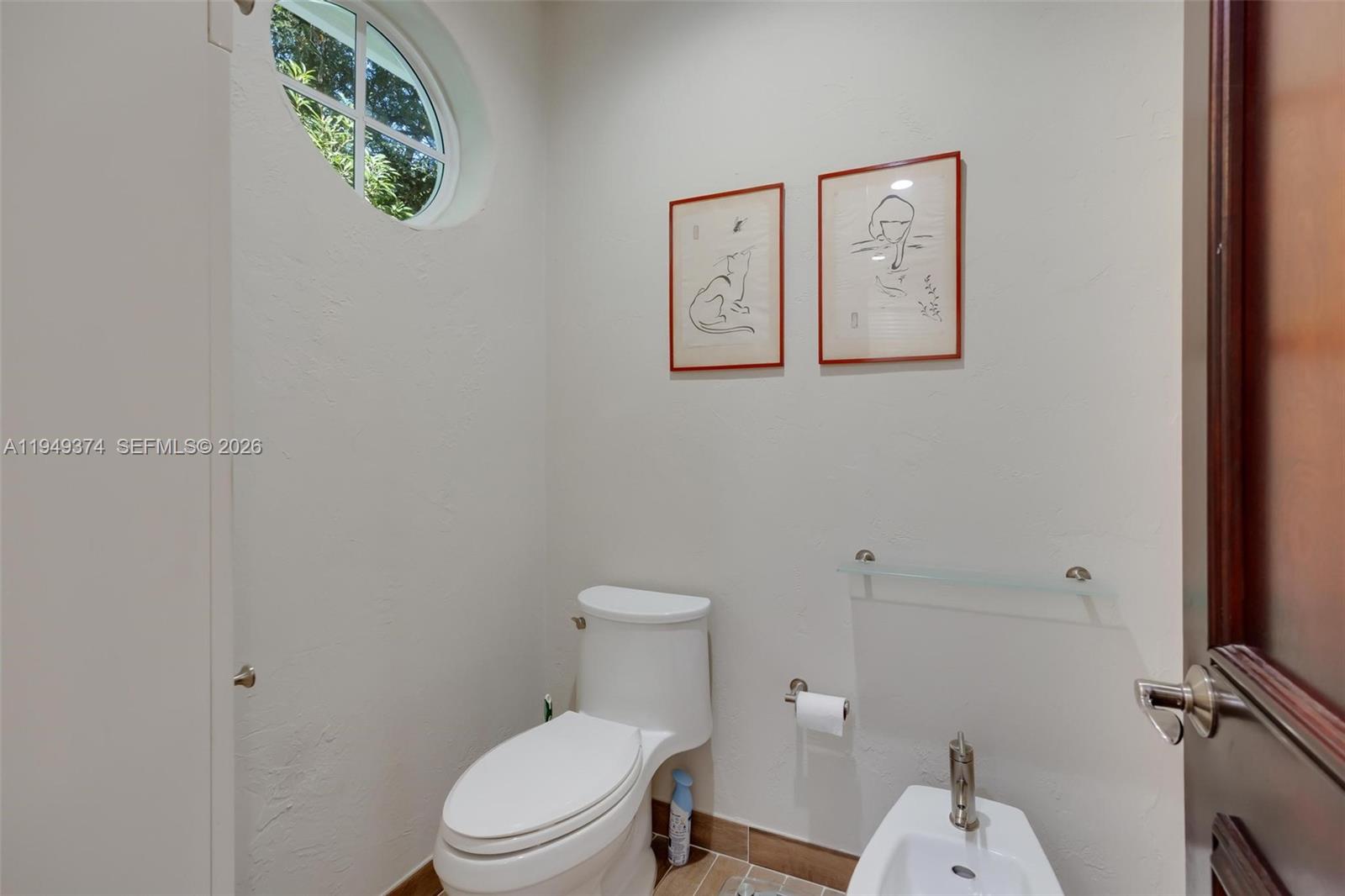 205 South Harbor Drive Key Largo, FL 33037 - Photo 27 of 50 a white toilet sitting next to a bathroom sink