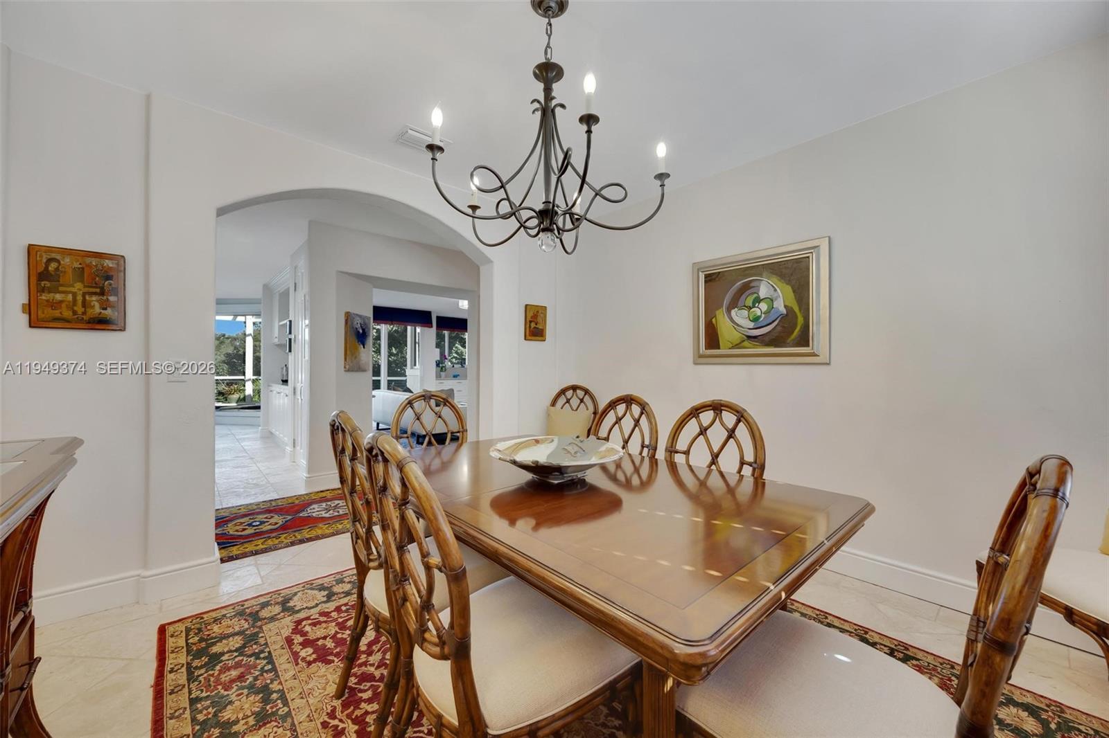 205 South Harbor Drive Key Largo, FL 33037 - Photo 30 of 50 a view of a dining room with furniture a chandelier and wooden floor