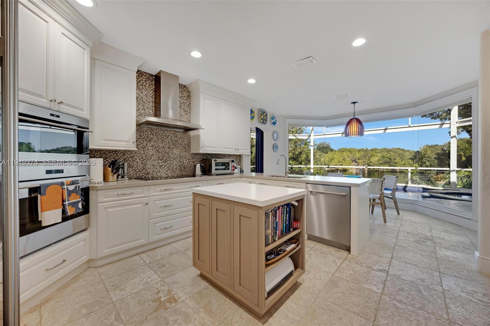 205 South Harbor Drive Key Largo, FL 33037 - Photo 31 of 50 a kitchen with a stove a sink and a refrigerator