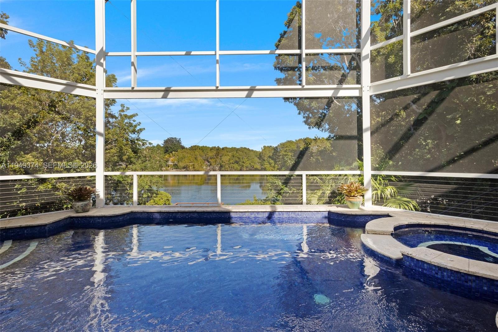 205 South Harbor Drive Key Largo, FL 33037 - Photo 4 of 50 a view of a balcony with floor to ceiling windows with wooden floor