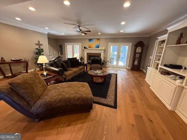 a kitchen with stainless steel appliances granite countertop a refrigerator a sink a stove a microwave and island