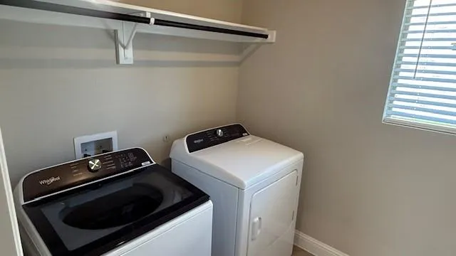a utility room with dryer and washer