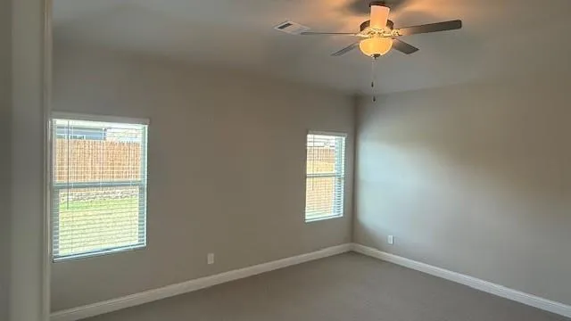 a view of empty room with windows