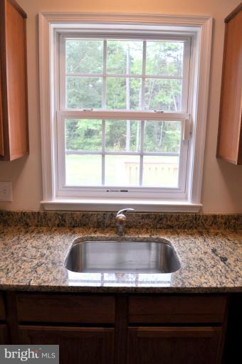 2220 Partlow Road Beaverdam, VA 23015 - Photo 12 of 24 a kitchen with granite countertop sink and window
