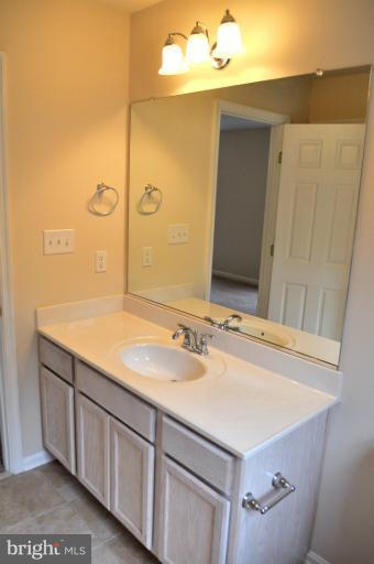 2220 Partlow Road Beaverdam, VA 23015 - Photo 13 of 24 a bathroom with a sink and a mirror
