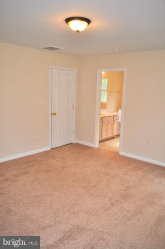 2220 Partlow Road Beaverdam, VA 23015 - Photo 19 of 24 an empty room with a empty space and windows