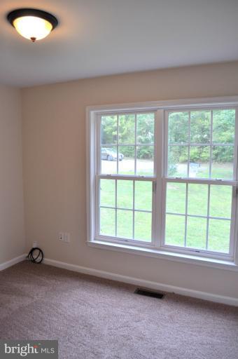 2220 Partlow Road Beaverdam, VA 23015 - Photo 5 of 24 a view of an empty room with a window