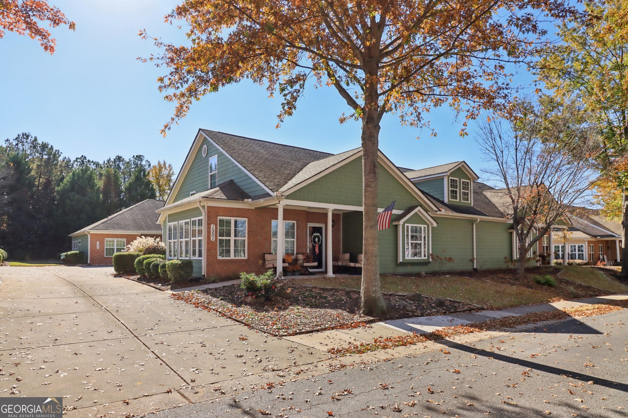 1502 Commonwealth Circle Newnan, GA 30263 - Photo 3 of 30 a front view of a house with a yard