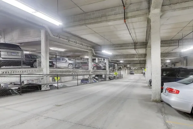 a view of a garage with cars