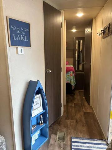 a bedroom with a bed and a mirror