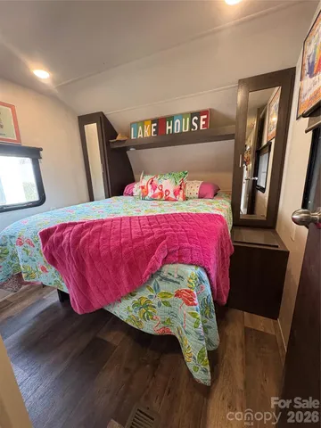 a bathroom with a sink a toilet a mirror and vanity