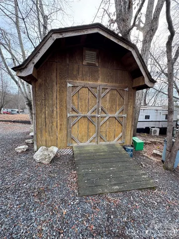a view of a roof deck with wooden floor and fence