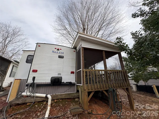 a view of a house with a snow in the yard