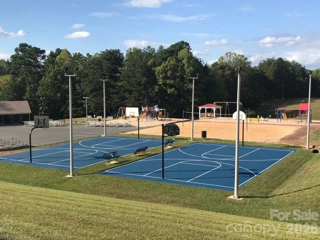a view of a yard with swimming pool and mountains