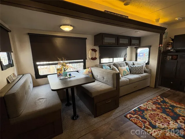 a kitchen with kitchen island a sink stove and refrigerator