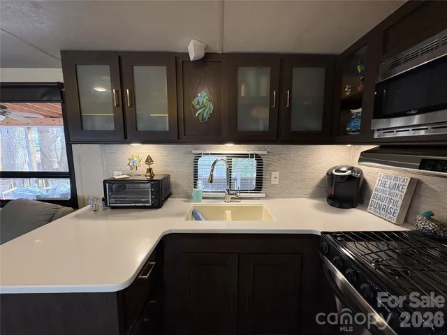 a kitchen with a refrigerator stove and microwave