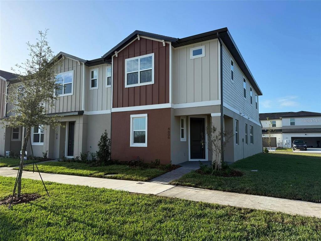 4806 Prairie Preserve Run St. Cloud, FL 34772 - Photo 1 of 13 a house view with a garden space