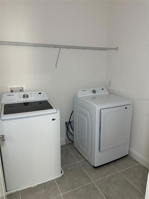 4806 Prairie Preserve Run St. Cloud, FL 34772 - Photo 11 of 13 a utility room with dryer and washer