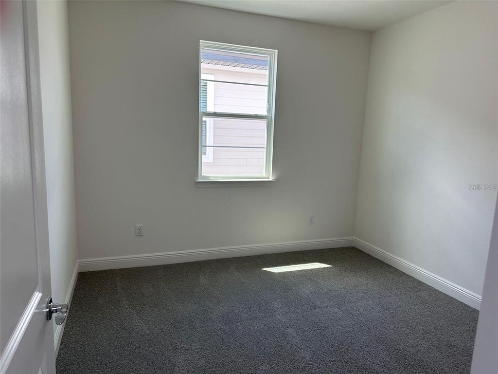 4806 Prairie Preserve Run St. Cloud, FL 34772 - Photo 9 of 13 an empty room with a window