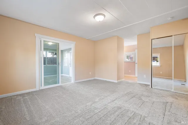 a view of an empty room and window