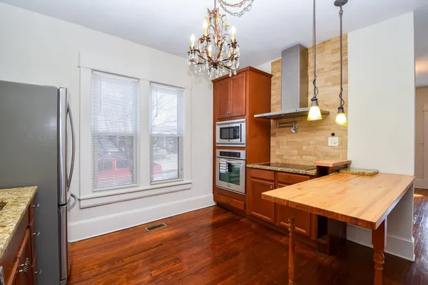 a workspace with furniture window and wooden floor
