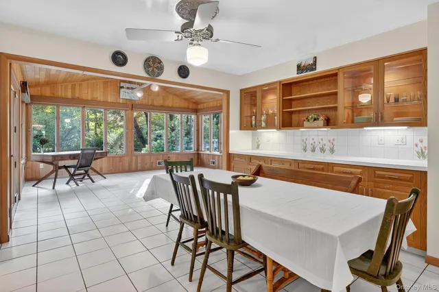 a view of a dining room with furniture window and outside view