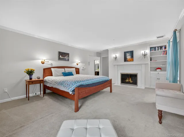 a bedroom with a large bed and a couch