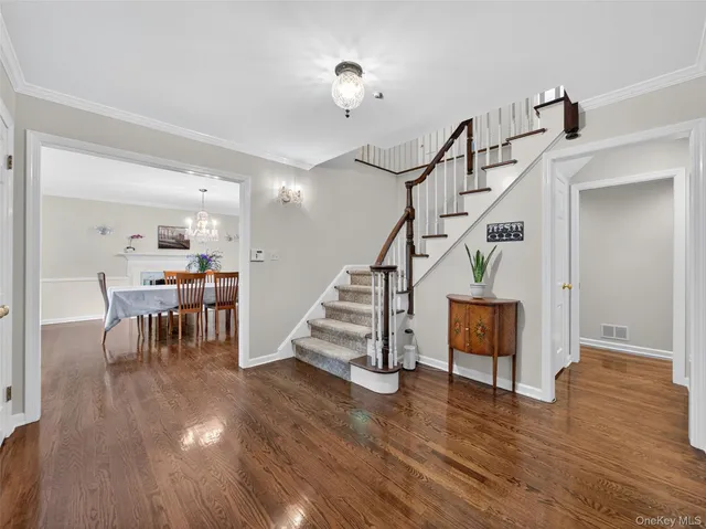 a view of a livingroom with furniture and hardwood floor