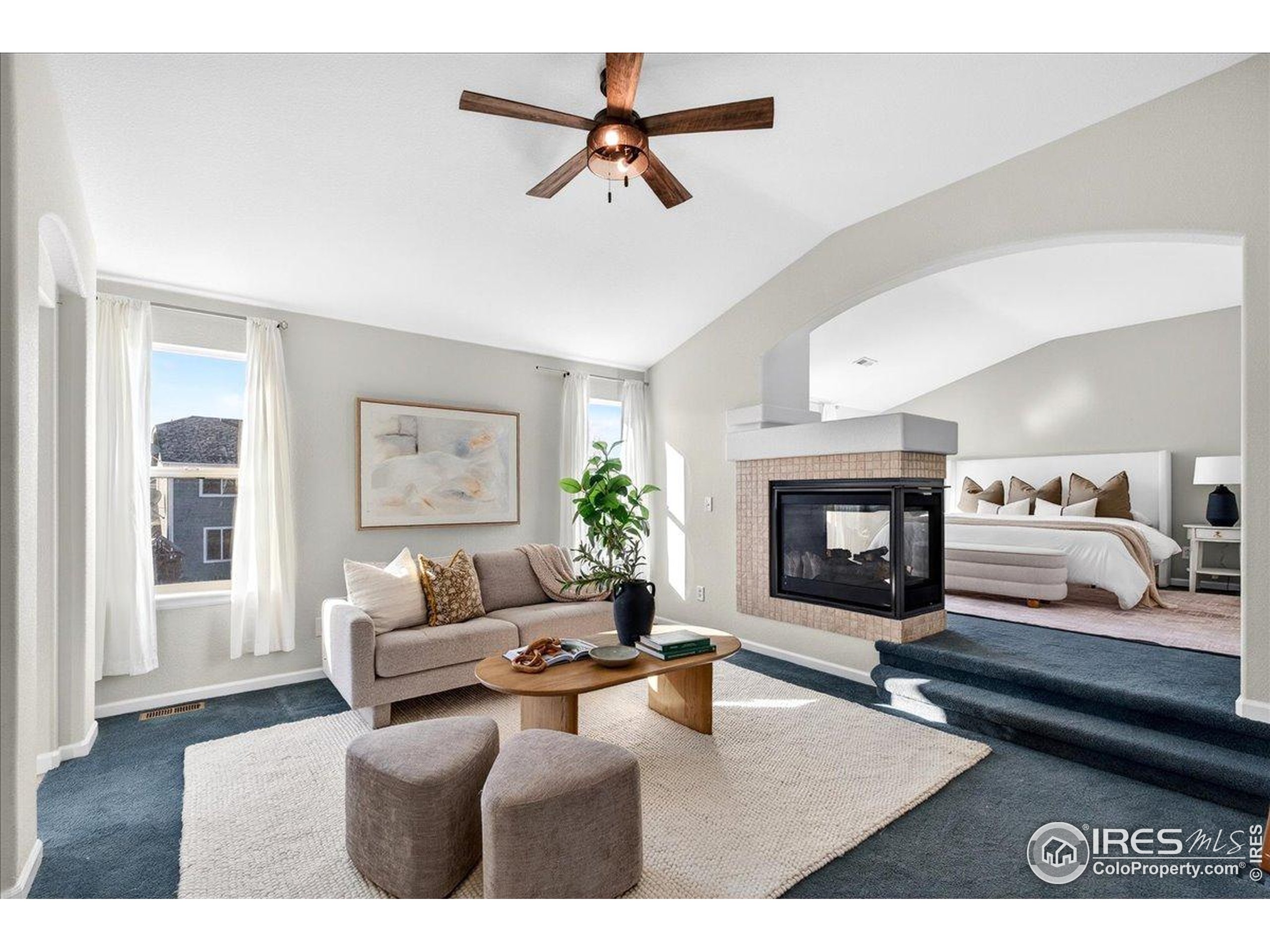 210 Saxony Road Johnstown, CO 80534 - Photo 11 of 34 a living room with furniture and a fireplace