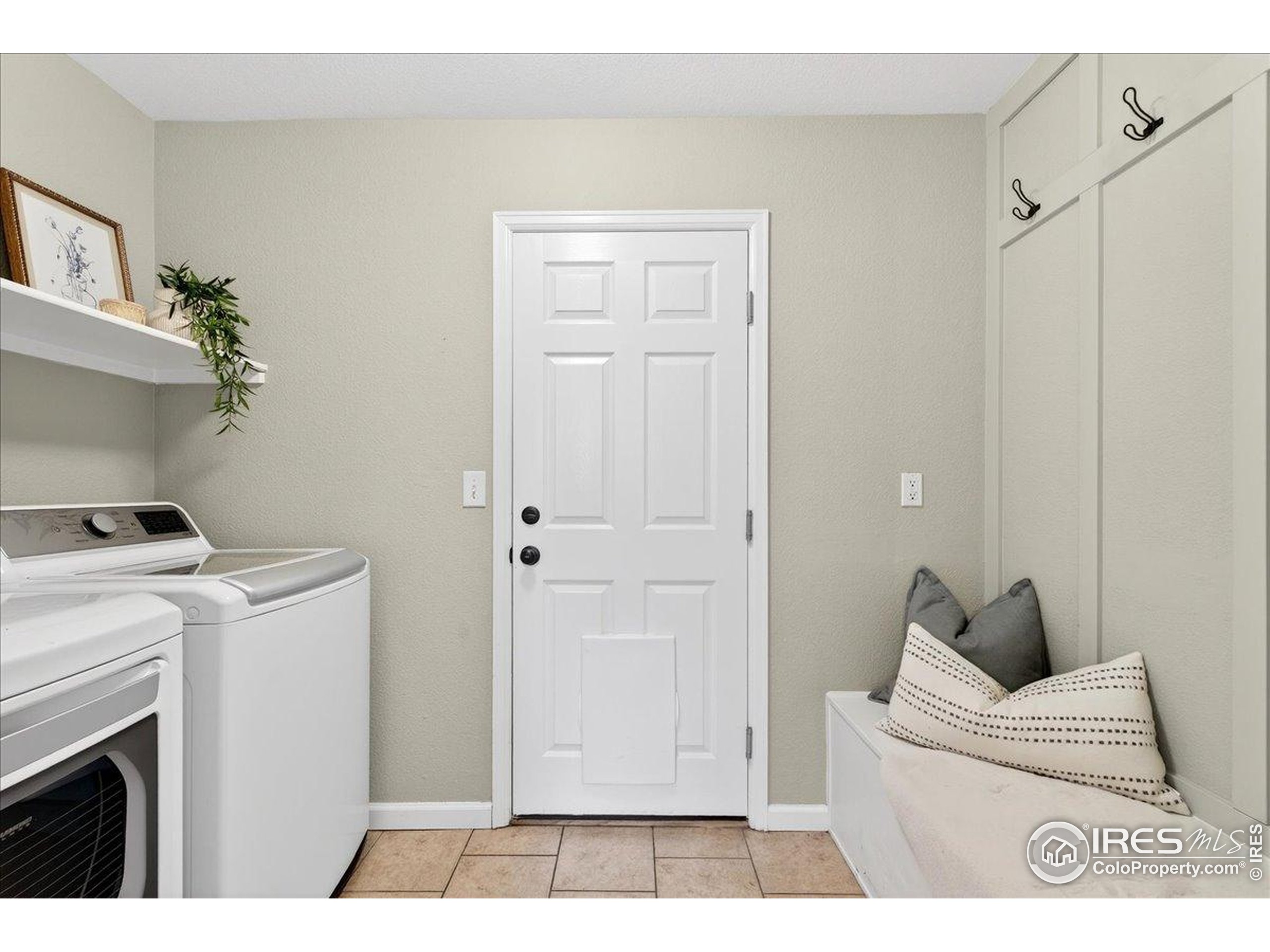 210 Saxony Road Johnstown, CO 80534 - Photo 12 of 34 a living room with a couch and a stove with wooden floor