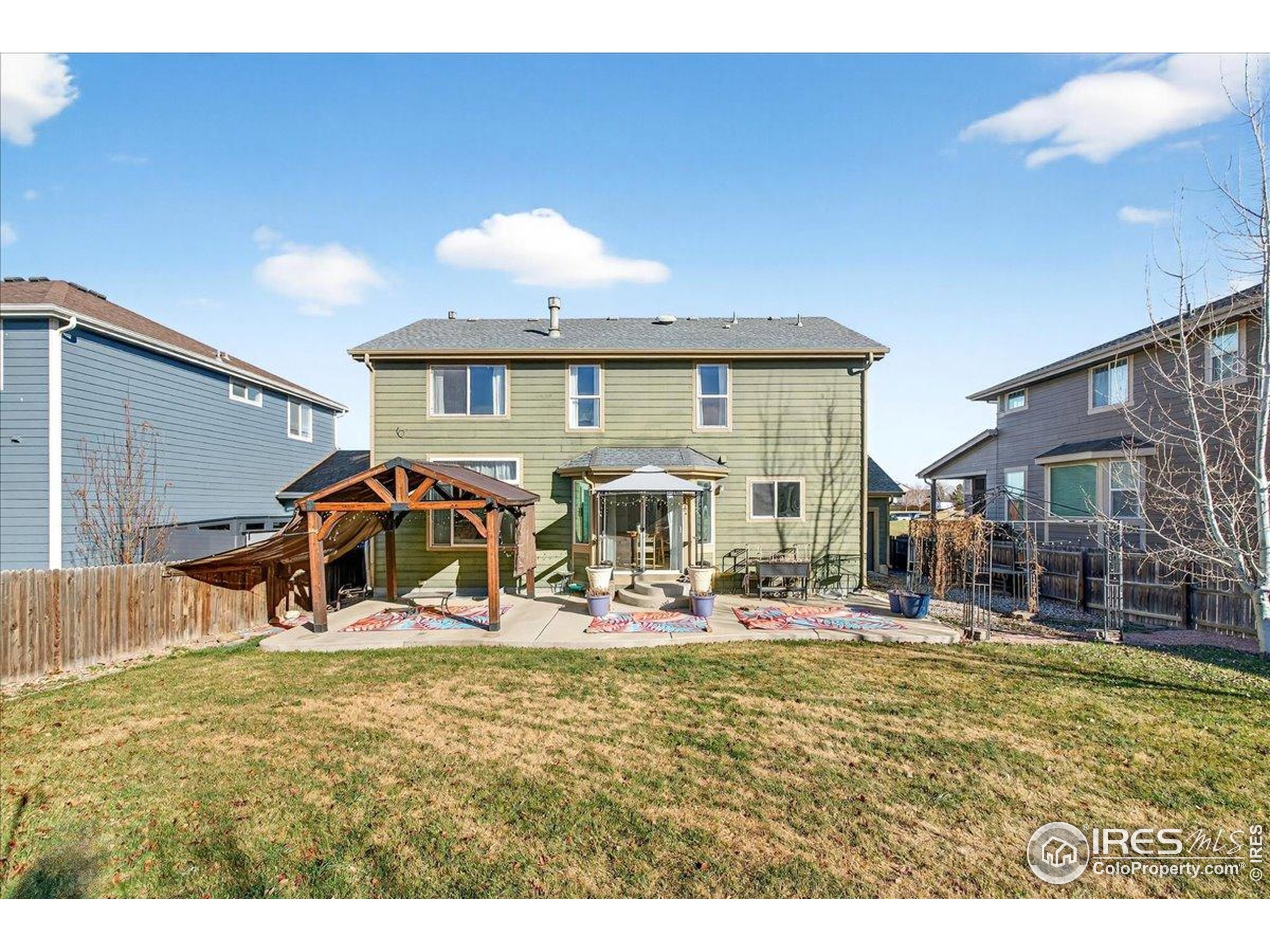 210 Saxony Road Johnstown, CO 80534 - Photo 13 of 28 a view of a livingroom with furniture and a yard