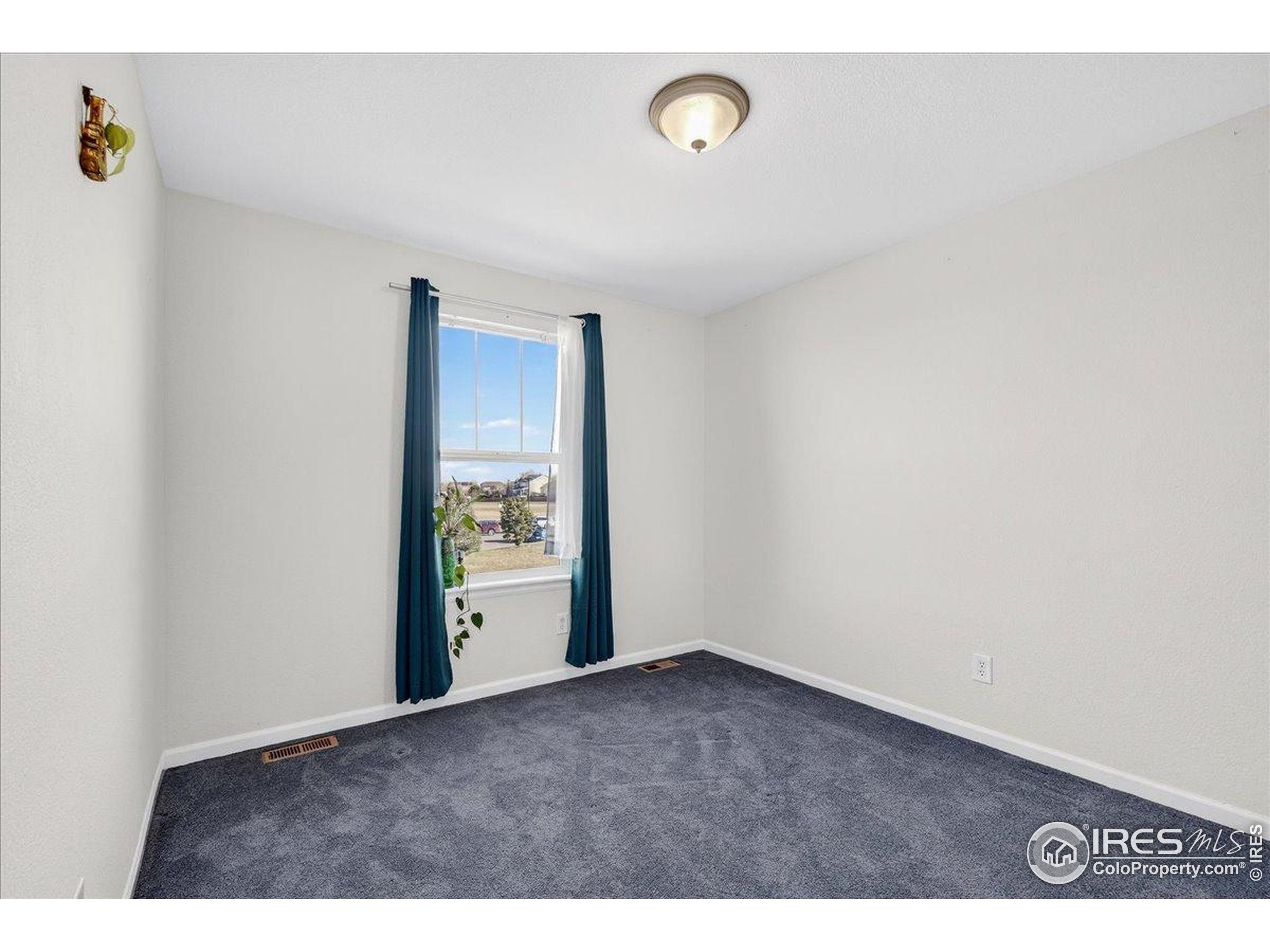 210 Saxony Road Johnstown, CO 80534 - Photo 19 of 34 a view of an empty room