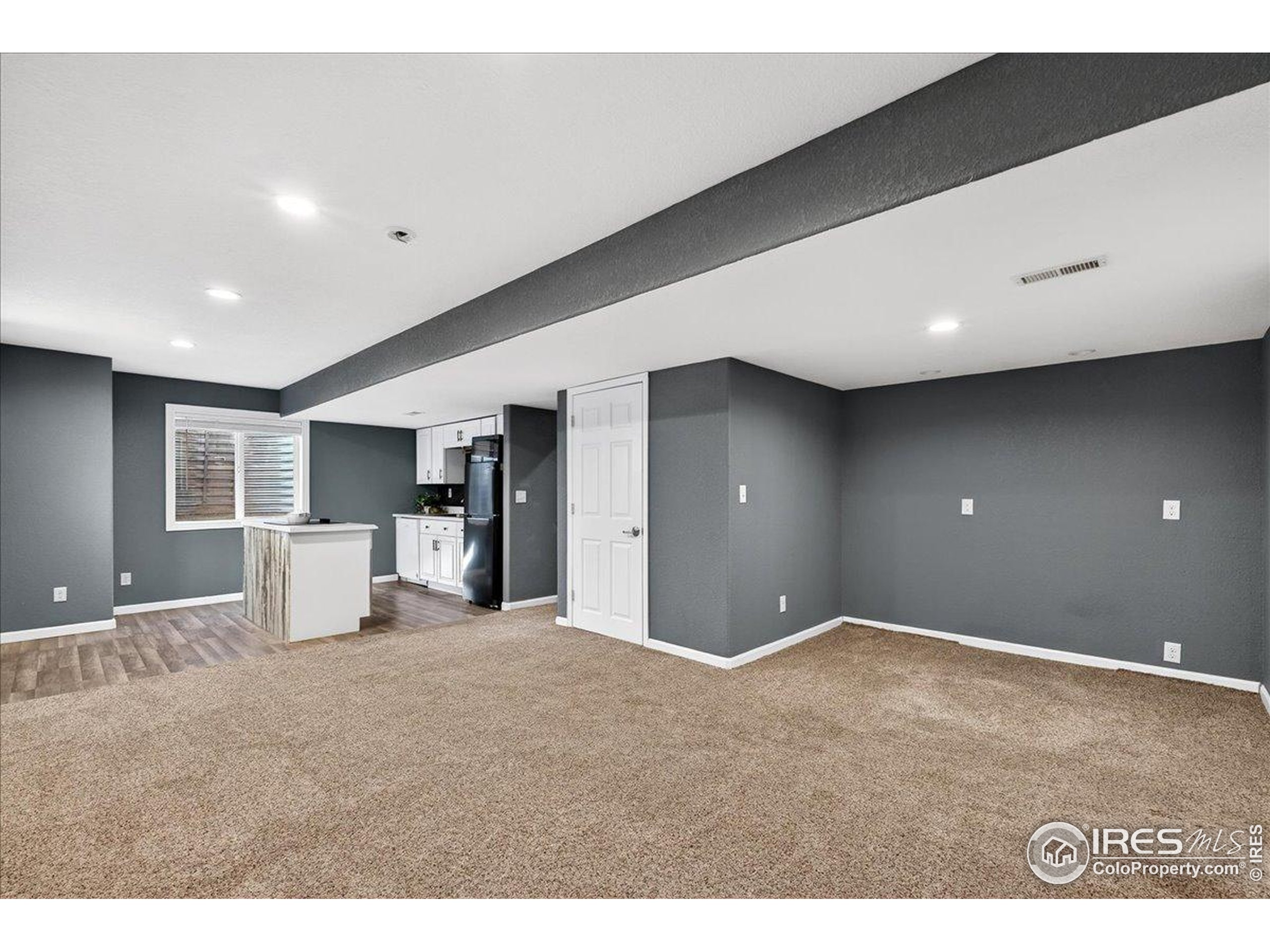 210 Saxony Road Johnstown, CO 80534 - Photo 21 of 34 a view of a livingroom with a staircase