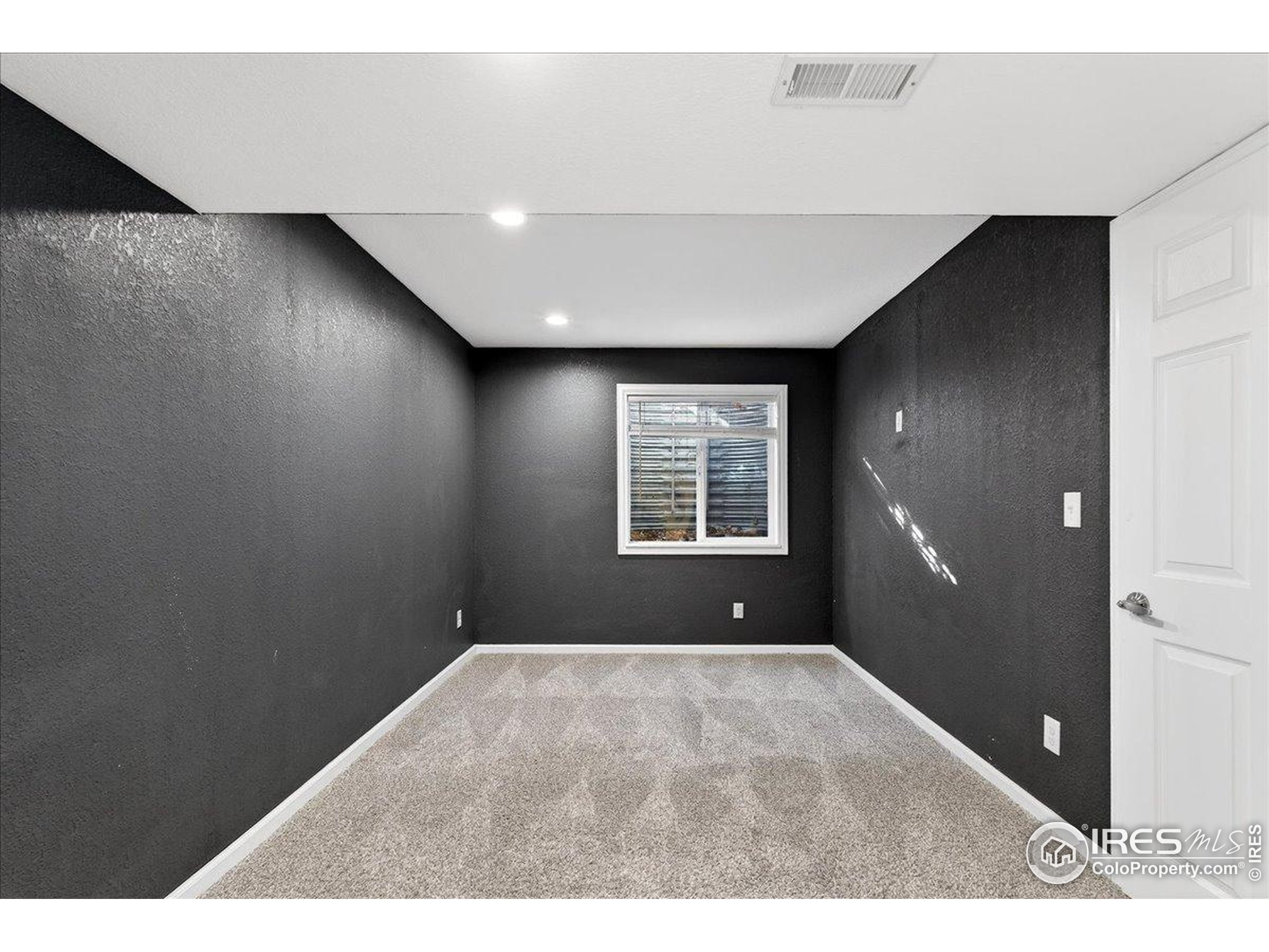 210 Saxony Road Johnstown, CO 80534 - Photo 24 of 34 a view of an empty room with a window